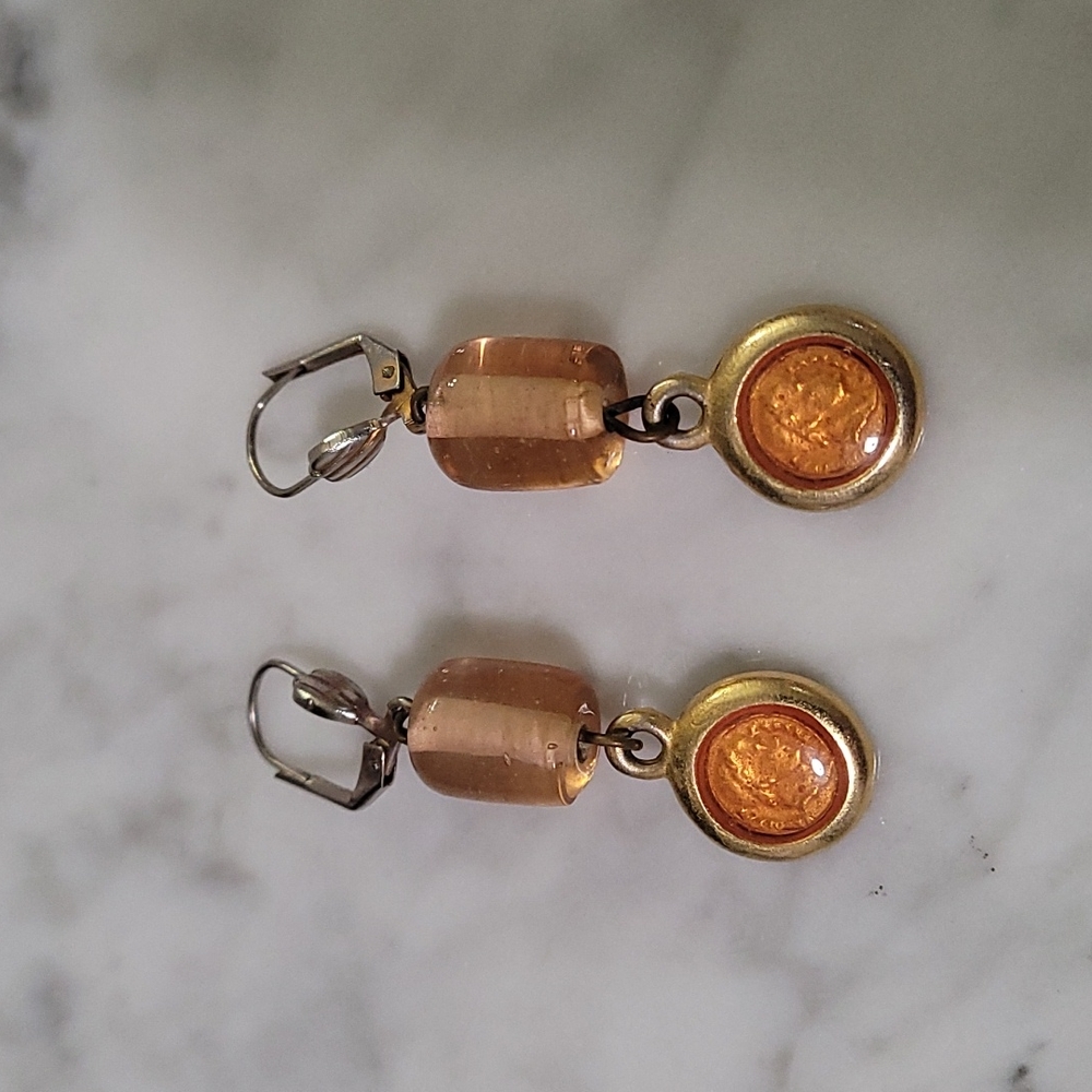 Costume jewelry...peach and gold dangling earrings.